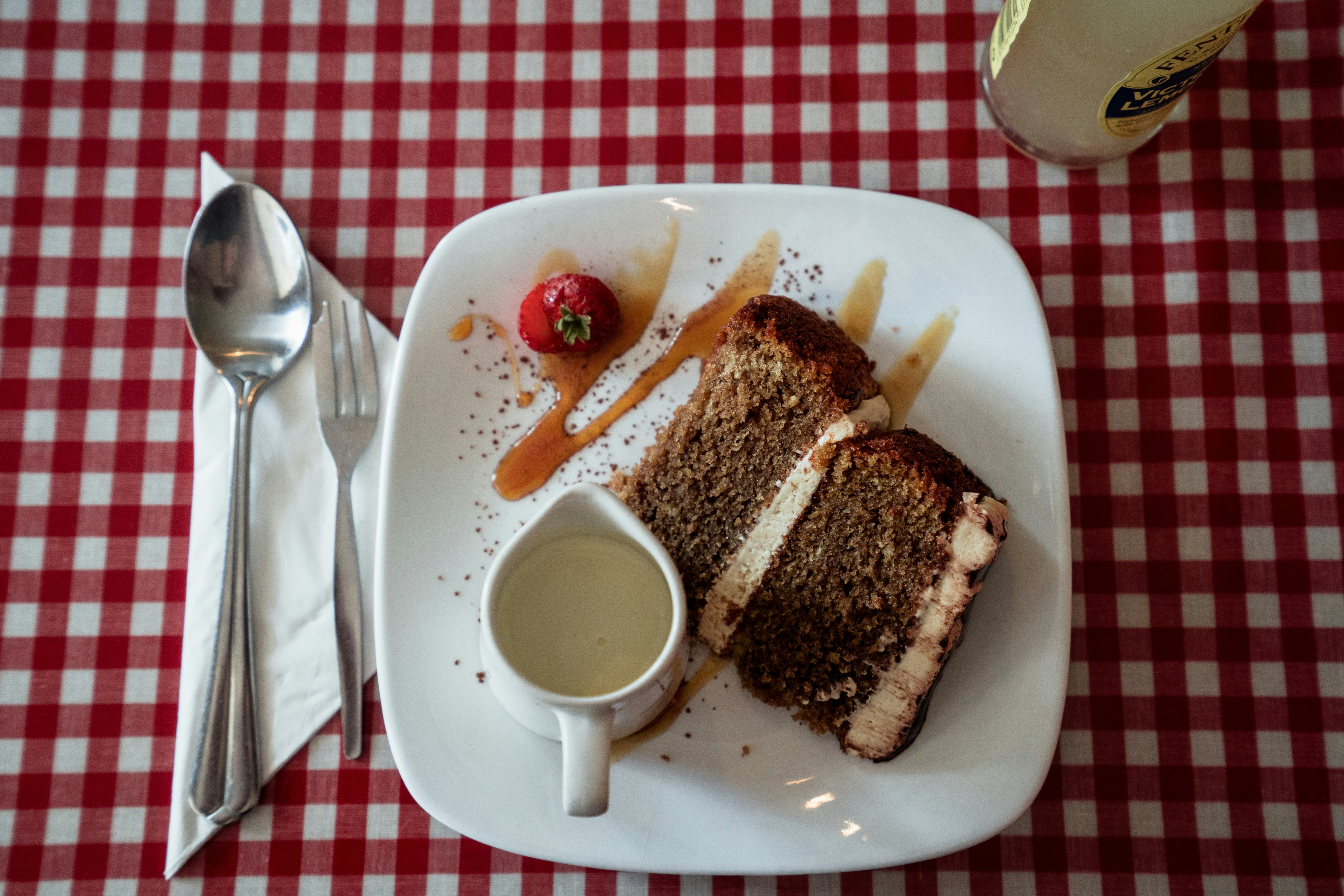 sliced cake and strawberry on plate